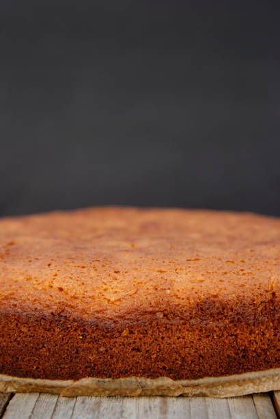 istock Casic sponge cake Pan di Spagna selective focus. Homemade cake. Dessert cooking. Vertical image. 1058068832