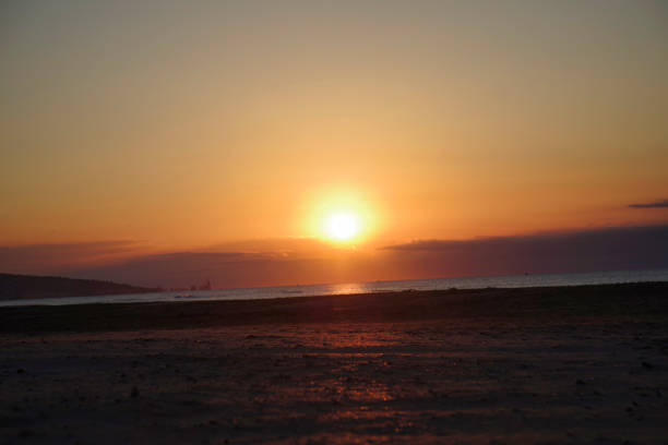 istock wonderful sunset at the beach 1058072352