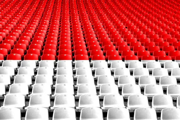 Photo of Indonesia flag stadium seats. Sports competition concept.