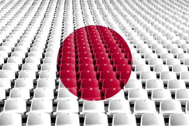 Photo of Japan flag stadium seats. Sports competition concept.