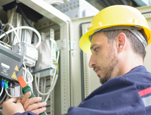 istock Electrician testing for voltage in a fuse box 1058078628