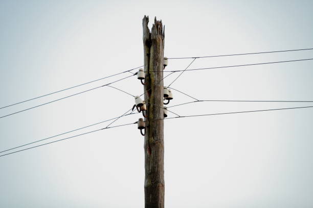 istock Old power lines on a wooden pole. 1058082794