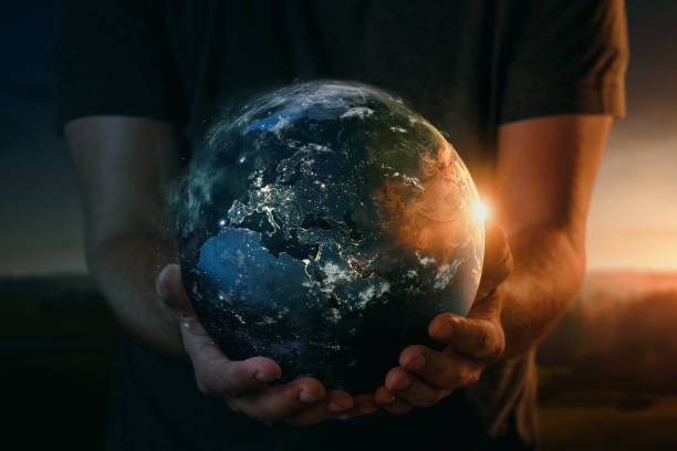 planet earth in human hand - earth globe human hand symbols of peace imagens e fotografias de stock