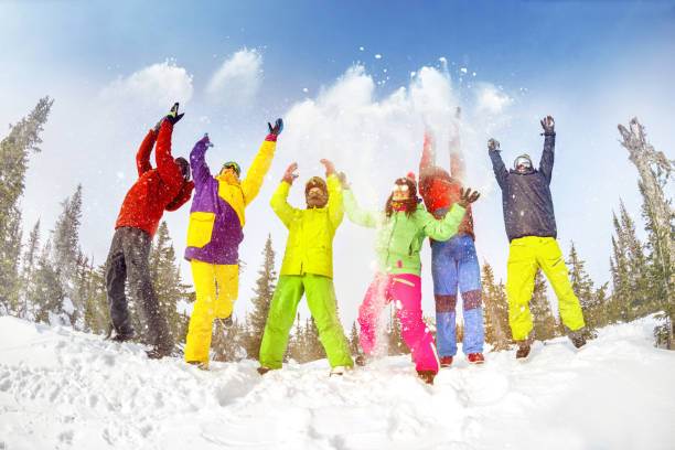 istock Happy friends having fun winter ski resort 1058085738