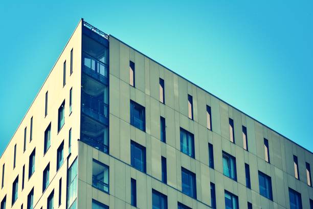 istock Modern apartment building exterior. Retro colors stylization 1058090608