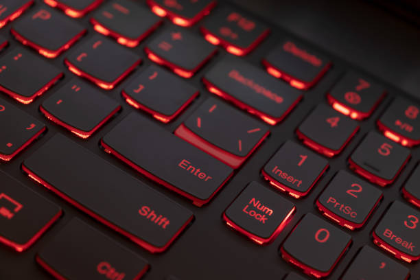 istock Colorful keyboard for gaming. Backlit keyboard with red color scheme. Colorful light keyboard 1058093942