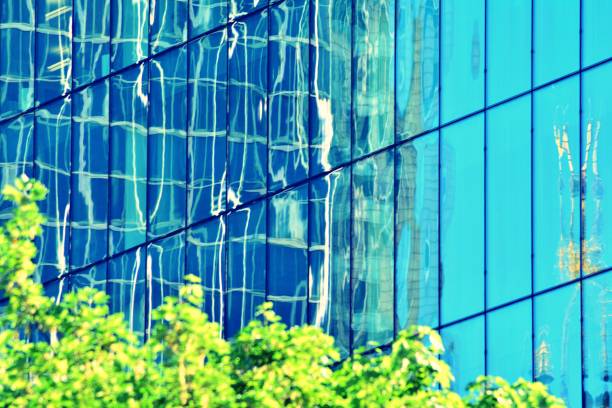 istock Modern office building on a clear sky background. Retro stylized colorful tonal filter effect 1058096930