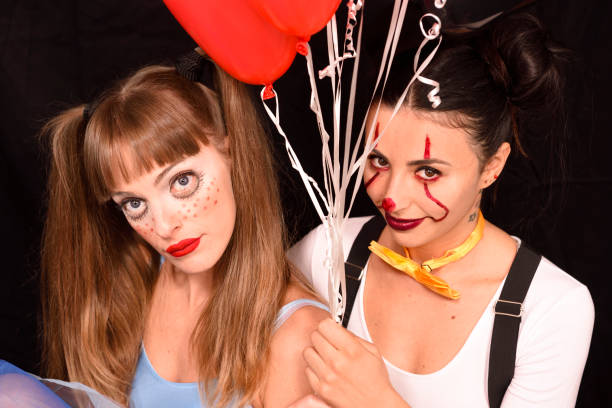 istock halloween creepy make-up girls 1058097078