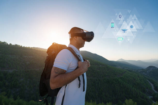 istock Climber enjoys the view from the top of the mountain with vr 1058098048