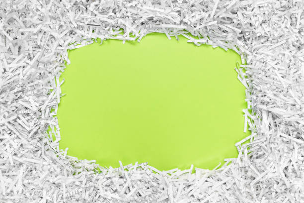 Frame with copy space made of recycled shredded paper Frame with copy space made of shredded paper. Recycling and environment protection concept. paper shredder stock pictures, royalty-free photos & images