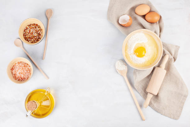 istock Ingredients and kitchen utensils for dough preparation 1058100608
