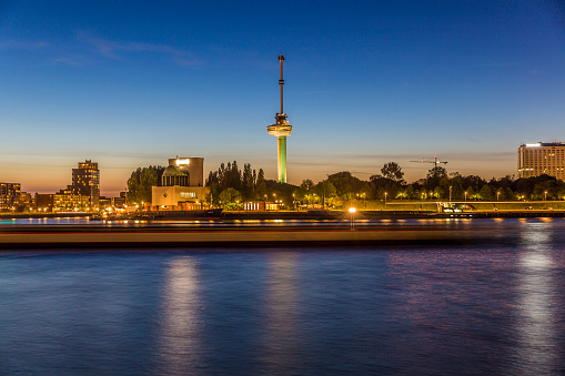beautiful view of the Euromast tower in Rotterdam in the Netherlands Holland at night with reflection of lights