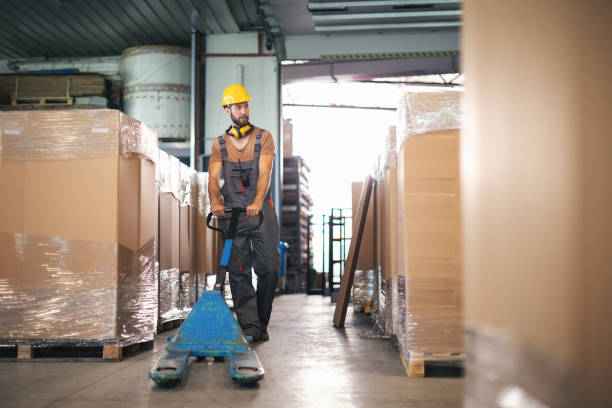 istock Young male worker in the warehouse checking stuff 1058105534