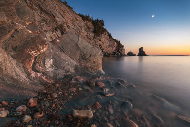 istock Rock formation ocean seascape sunset 1058108678