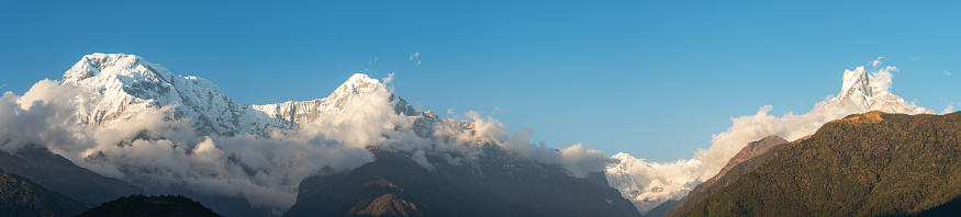 A panoramic view of of Annapurna South,  Hiunchuli,  Annapurna I, and Machapuchare in the Nepal Himalayas.