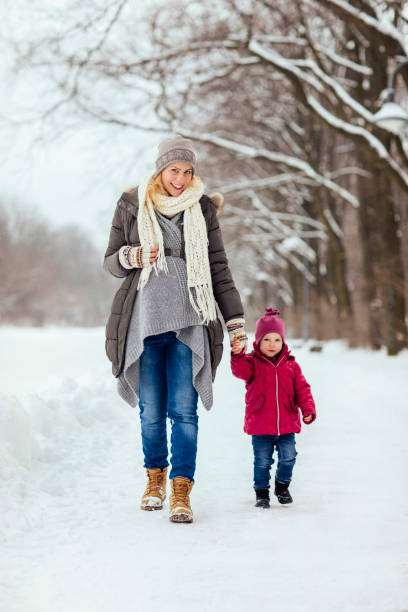 istock Mother and child on the snow 1058108858