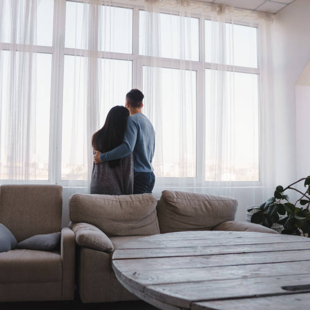 istock Happy new flat owners near the window 1058109846