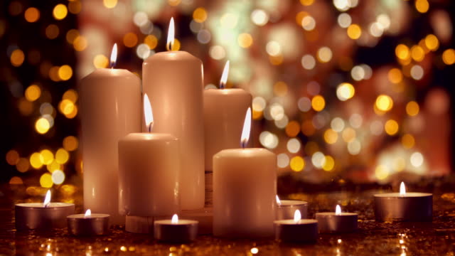 Christmas composition with burning white candles