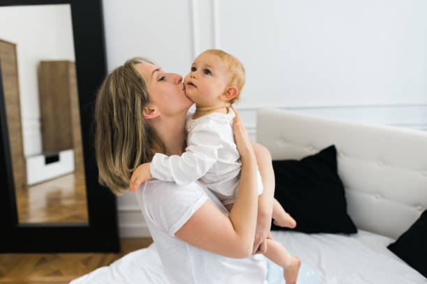 istock Mother holding the baby 1058112180