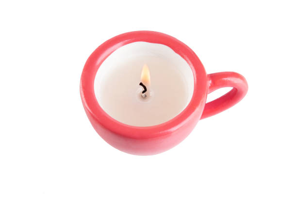 istock Top view of a burning candle isolated on white background 1058118020