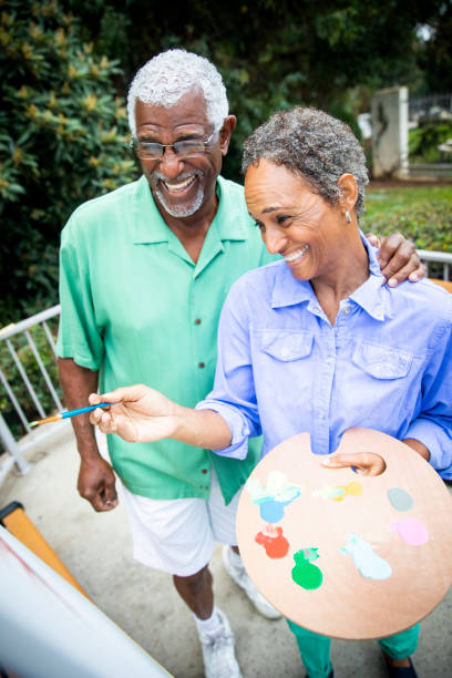 istock Senior Black Couple Painting on Canvas 1058122384