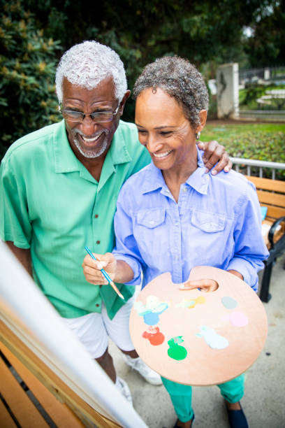 istock Senior Black Couple Painting on Canvas 1058122430