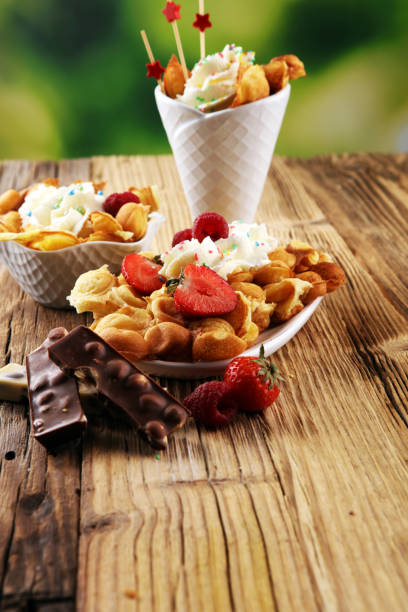istock Hong Kong style egg waffle on wooden board. bubble waffle 1058122550