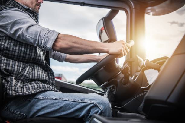 istock Truck Driver Behind the Wheel 1058124500