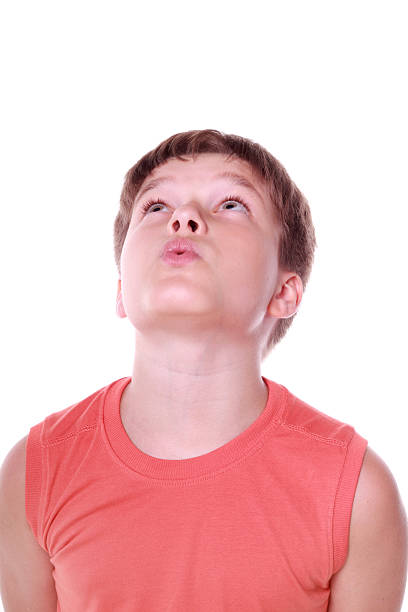 istock boy looking up and whistling 105813584