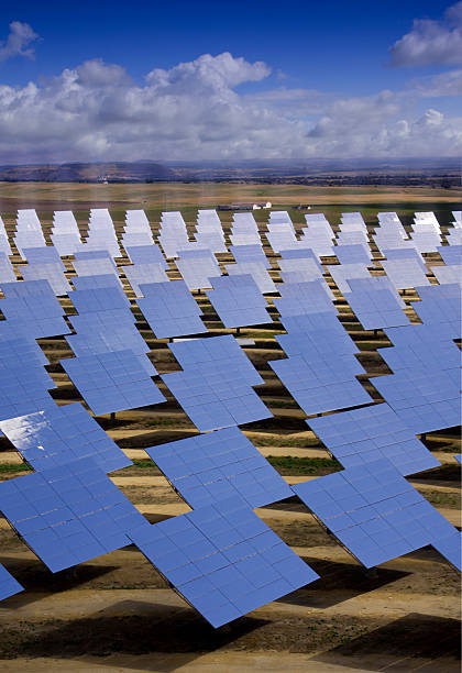 Solar heliostats for sun powered energy production stock photo