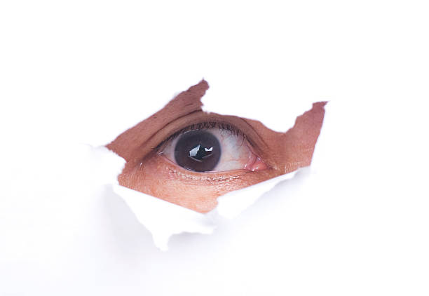 istock Man with scary look from paper hole 105813769