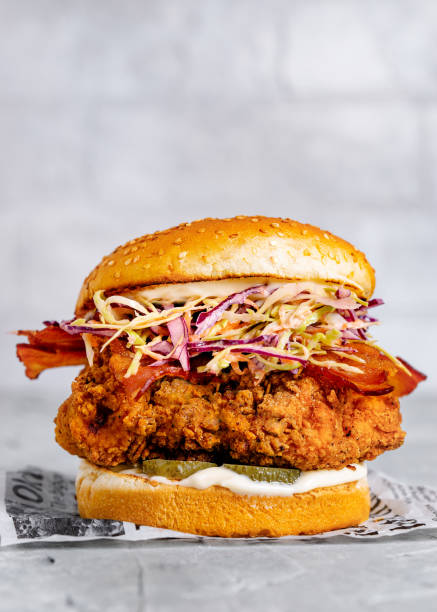 istock Fried chicken burger with bacon, pickled and coleslaw 1058140028