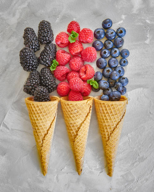 istock Berries in ice cream cones 1058140204