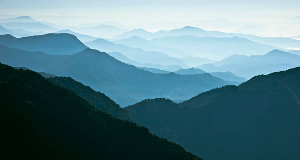 istock Mountain range in blue light and fog 105814525