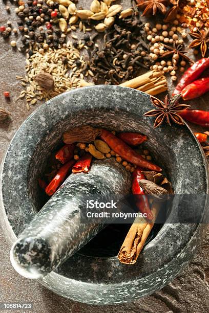 Spices With Mortar And Pestle Stock Photo - Download Image Now - Garam Masala, Mortar and Pestle, Cardamom