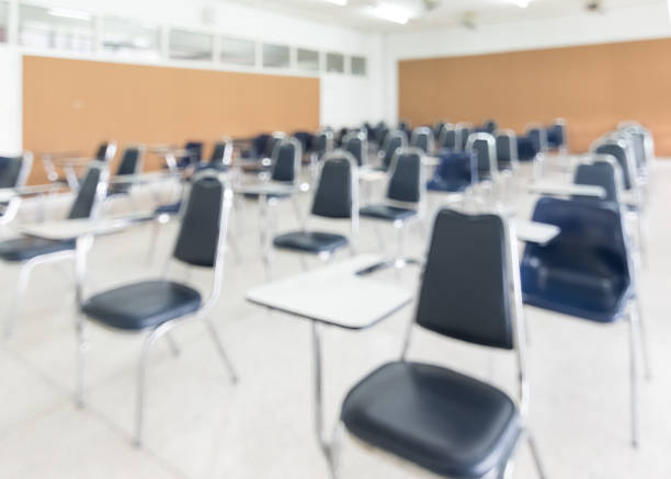 istock Blur classroom education background empty school class lecture room interior view with no teacher nor student 1058161066