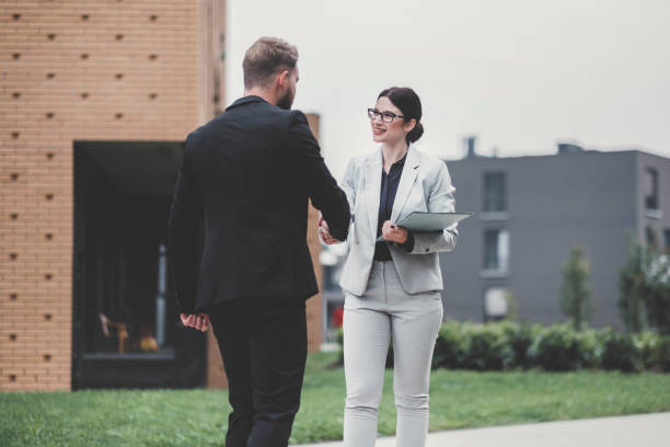 istock Real estate agent and businessman customer 1058163440