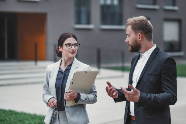 istock Real estate agent and businessman customer 1058163590