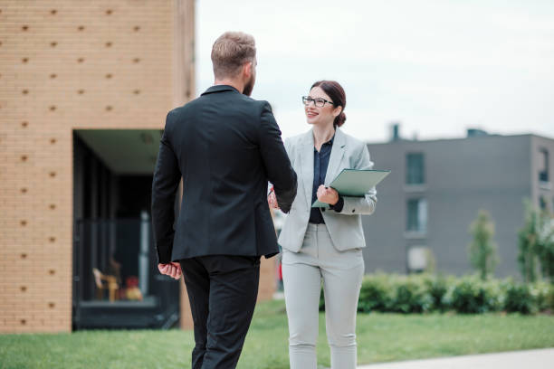 istock Real estate agent and businessman customer 1058163826