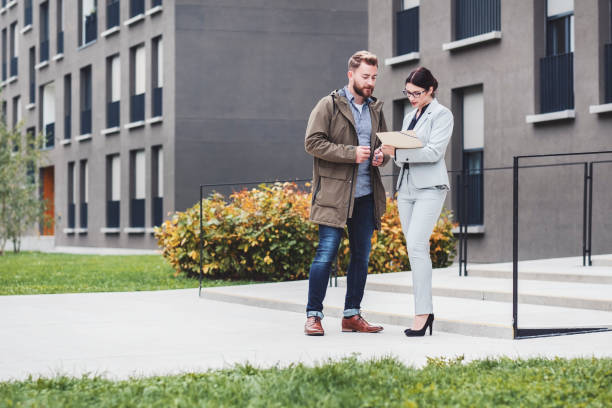 istock Real estate agent and customer looking for apartment 1058163918