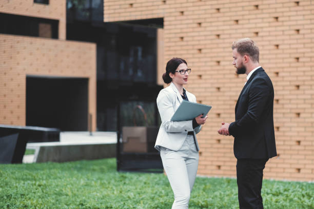 istock Real estate agent and businessman customer 1058166838