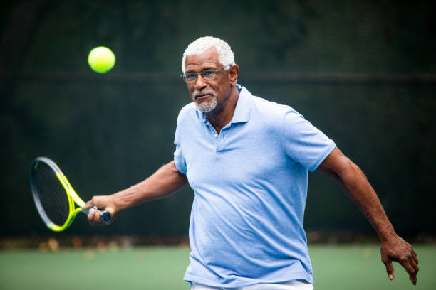 istock Senior Black Man Playing Tennis 1058167194