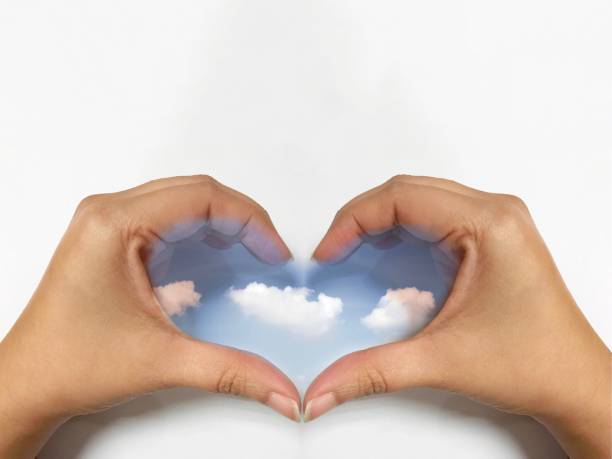 istock Sky in woman hand heart shape on white background 1058168428