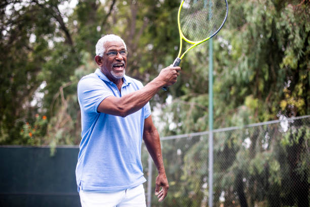 istock Senior Black Man Playing Tennis 1058168602