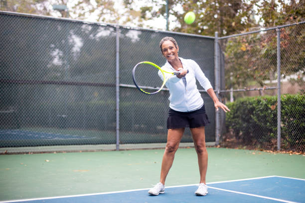 istock Black Woman Playing Tennis 1058168608