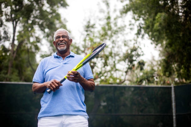 istock Senior Black Man Playing Tennis 1058168626