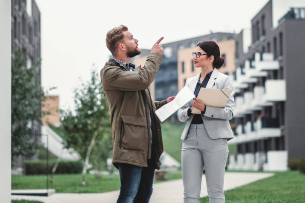 istock Real estate agent and customer looking for apartment 1058168786