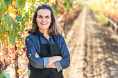 Mature female business owner posing at her vineyard