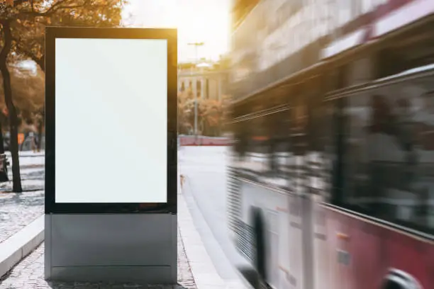 Photo of City banner mock-up and red bus with motion blur