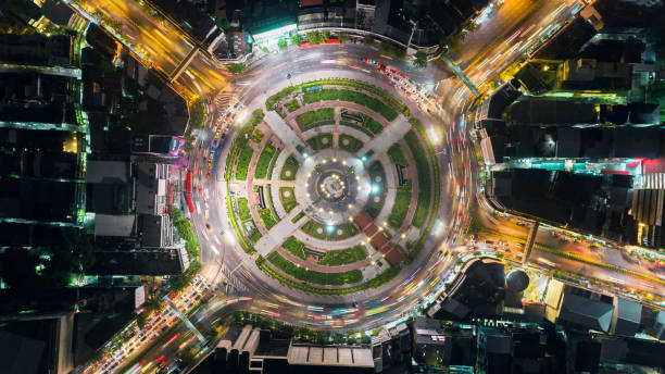 istock Aerial view beautiful pattern highway road intersection at night  for transportation, distribution or traffic background. 1058174232
